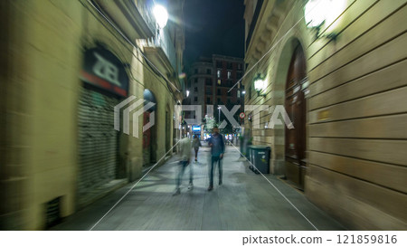 Fast walk through narrow street in the Old Town timelapse hyperlapse, Barcelona. Gothic district illuminated at night Fast walk through narrow street in the Old Town timelapse hyperlapse, Barcelona. Gothic district illuminated at night 121859816