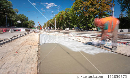 Road construction site with tram tracks repair and maintenance timelapse hyperlapse. 121859873