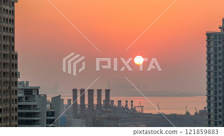 Aerial view of Dubai Marina from a vantage point at sunset timelapse. 121859883