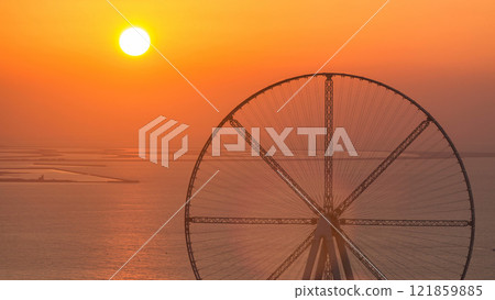 Bluewaters island at sunset aerial timelapse with ferris wheel 121859885