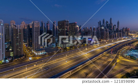 Dubai Marina skyscrapers aerial top view before sunrise from JLT in Dubai night to day timelapse, UAE. Dubai Marina skyscrapers aerial top view before sunrise from JLT in Dubai night to day timelapse, UAE. 121859890
