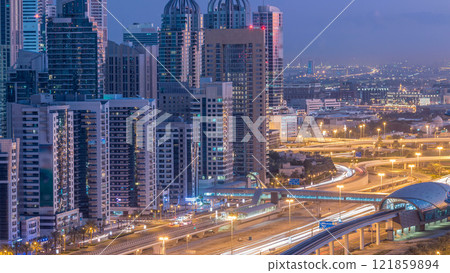 Dubai Marina skyscrapers aerial top view before sunrise from JLT in Dubai night to day timelapse, UAE. Dubai Marina skyscrapers aerial top view before sunrise from JLT in Dubai night to day timelapse, UAE. 121859894