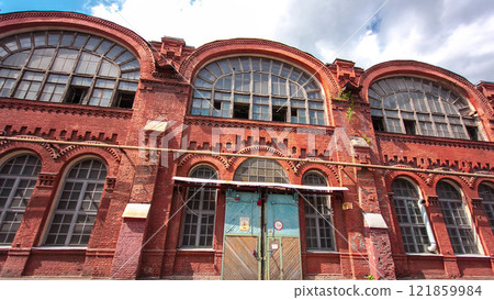 The old factory bricks building with windows and gates timelapse hyperlapse 121859984