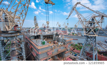 The construction of a large ship on a shipyard with cranes timelapse. The construction of a large ship on a shipyard with cranes timelapse. 121859985