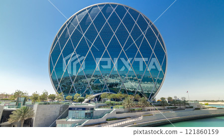 Circular skyscraper Aldar Headquarters Building timelapse hyperlapse in Abu Dhabi, UAE. Circular skyscraper Aldar Headquarters Building timelapse hyperlapse in Abu Dhabi, UAE. 121860159