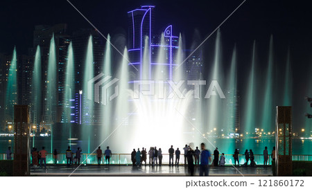 Evening Musical fountain show. Singing fountains in Sharjah timelapse, UAE Evening Musical fountain show. Singing fountains in Sharjah timelapse, UAE 121860172
