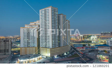 Cityscape with towers in Ajman from rooftop day to night timelapse. United Arab Emirates. Cityscape with towers in Ajman from rooftop day to night timelapse. United Arab Emirates. 121860201
