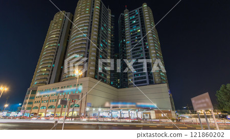 Modern new towers in Ajman night timelapse hyperlapse. Cityscape of Ajman. Modern new towers in Ajman night timelapse hyperlapse. Cityscape of Ajman. 121860202