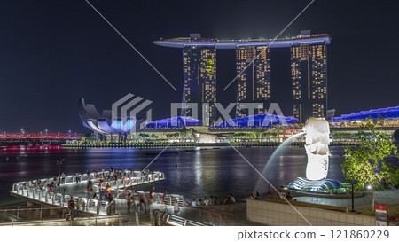 The Merlion fountain spouts water in front of the Marina Bay Sands hotel in Singapore timelapse hyperlapse. 121860229