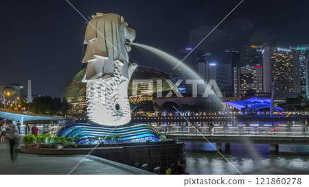 The Merlion fountain and Singapore skyline night timelapse hyperlapse. 121860278