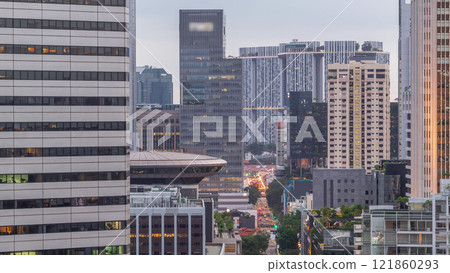 Evening panorama with Marina Bay area and skyscrapers city skyline aerial day to night timelapse. 121860293
