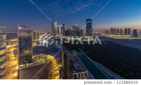 Buildings on Al Reem island in Abu Dhabi day to night timelapse from above. Buildings on Al Reem island in Abu Dhabi day to night timelapse from above. 121860310
