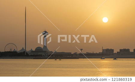 Sunset in Abu Dhabi over Marina Island timelapse 121860319