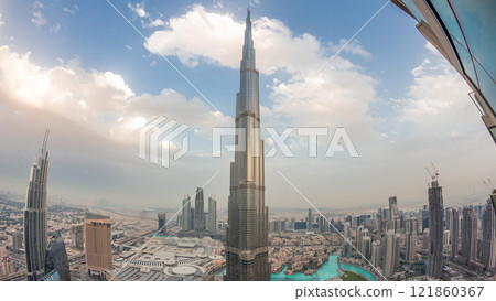 Panoramic skyline view of Dubai downtown with mall, fountains and Burj Khalifa aerial day to night timelapse Panoramic skyline view of Dubai downtown with mall, fountains and Burj Khalifa aerial day to night timelapse 121860367