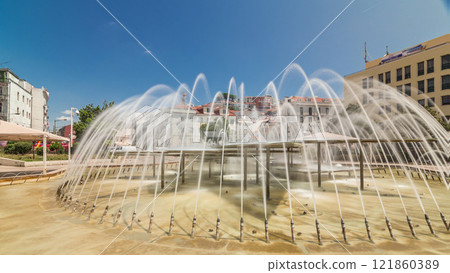 Fountain in Martim Moniz square timelapse hyperlapse in downtown Lisbon 121860389