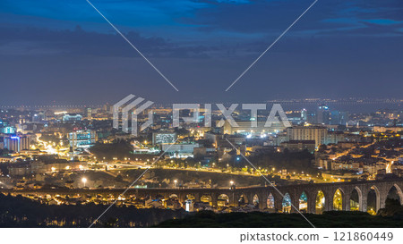Panoramic view over Lisbon and Almada from a viewpoint in Monsanto night to day timelapse. 121860449
