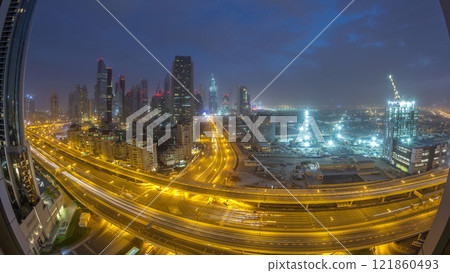 Dubai downtown skyline night to day aerial timelapse with traffic on highway Dubai downtown skyline night to day aerial timelapse with traffic on highway 121860493