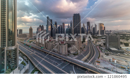 Skyline view of the buildings of Sheikh Zayed Road and DIFC timelapse in Dubai, UAE. 121860495