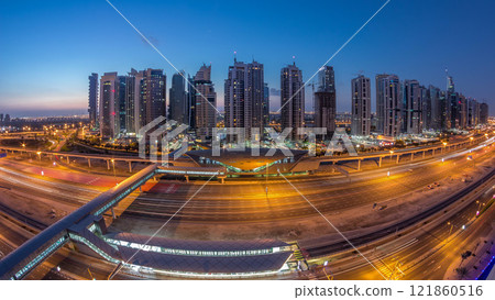 Aerial top view to Sheikh Zayed road near Dubai Marina and JLT night to day timelapse, Dubai. 121860516