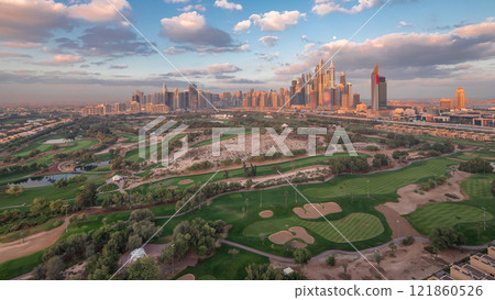 Dubai Marina skyscrapers and golf course morning timelapse, Dubai, United Arab Emirates Dubai Marina skyscrapers and golf course morning timelapse, Dubai, United Arab Emirates 121860526