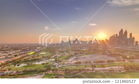 Dubai Marina skyscrapers and golf course sunset timelapse, Dubai, United Arab Emirates Dubai Marina skyscrapers and golf course sunset timelapse, Dubai, United Arab Emirates 121860527