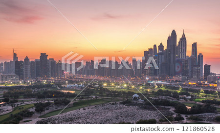 Dubai Marina skyscrapers and golf course day to night timelapse, Dubai, United Arab Emirates 121860528