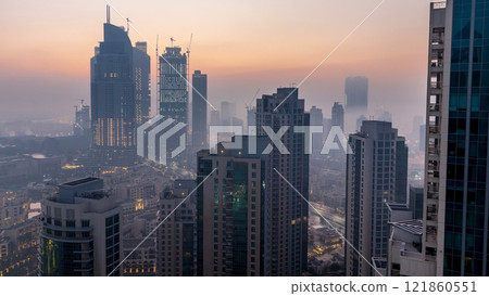 Foggy morning in downtown of Dubai night to day timelapse. 121860551