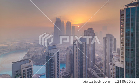 Foggy morning sunrise in downtown of Dubai timelapse. Foggy morning sunrise in downtown of Dubai timelapse. 121860553