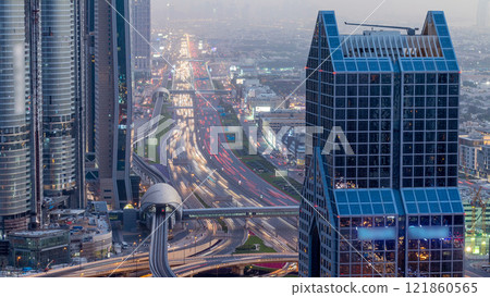 Dubai downtown skyline day to night timelapse and Sheikh Zayed road traffic, UAE Dubai downtown skyline day to night timelapse and Sheikh Zayed road traffic, UAE 121860565