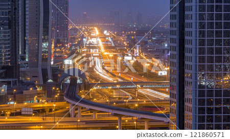 Dubai downtown skyline night to day timelapse and Sheikh Zayed road traffic, UAE Dubai downtown skyline night to day timelapse and Sheikh Zayed road traffic, UAE 121860571