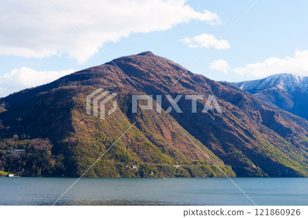 Wide panoramic scene of mountains and Como lake Wide panoramic scene of mountains and Como lake 121860926