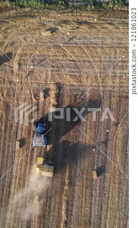 Harvest time in agriculture with equipment 121861023