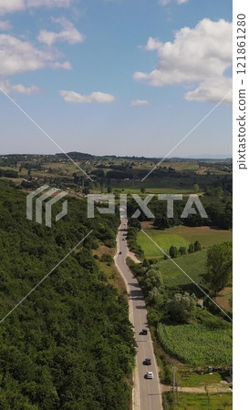Asphalt road driving car aerial drone Asphalt road driving car aerial drone 121861280