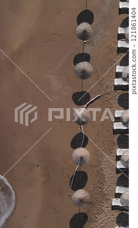 Empty beach umbrellas due to coronavirus Empty beach umbrellas due to coronavirus 121861404