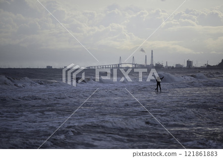 Winter morning sea surfer Winter morning sea surfer 121861883