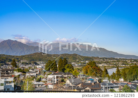 View of the cityscape of Iida and the Central Alps from the Tenryukyo IC area in Iida (Nagano Prefecture) 121862293