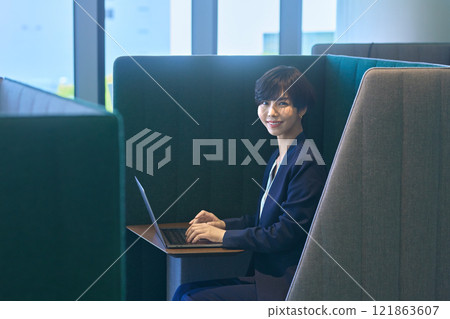 A businesswoman in a suit working at a desk in an office booth. Photo courtesy of LINK FOREST A businesswoman in a suit working at a desk in an office booth. Photo courtesy of LINK FOREST 121863607