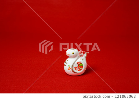 A cute snake figurine, a lucky charm for the beginning of the year in the Orient A cute snake figurine, a lucky charm for the beginning of the year in the Orient 121865068