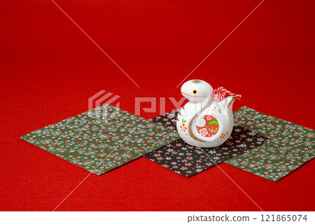 A cute snake figurine, a lucky charm for the beginning of the year in the Orient 121865074