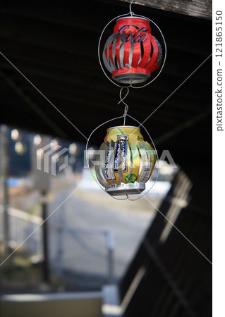 Windmill made of empty cans swaying in the wind 121865150