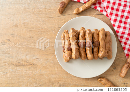 chocolate meringue stick on plate chocolate meringue stick on plate 121865205