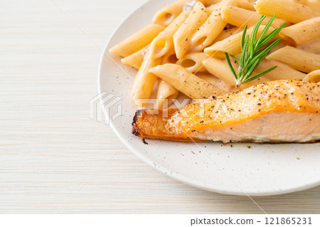 salmon with penne pasta cream sauce salmon with penne pasta cream sauce 121865231