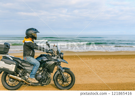 Bikes running along the coastline Bikes running along the coastline 121865416