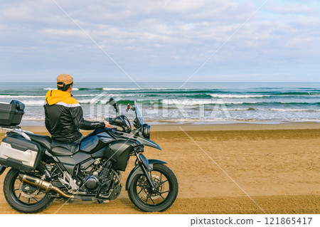 Bikes running along the coastline Bikes running along the coastline 121865417
