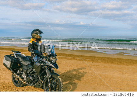 Bikes running along the coastline Bikes running along the coastline 121865419