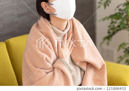 Middle-aged to senior woman in pain, clutching her chest 121866433