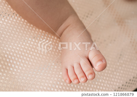 Baby's cute little feet Baby's cute little feet 121866879