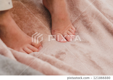 The feet of a 4-year-old girl resting on a soft cloth The feet of a 4-year-old girl resting on a soft cloth 121866880
