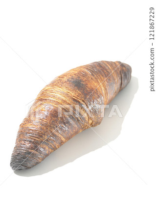 A slightly burnt black wasan photographed against a white background A slightly burnt black wasan photographed against a white background 121867229