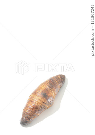 A slightly burnt black wasan photographed against a white background 121867243